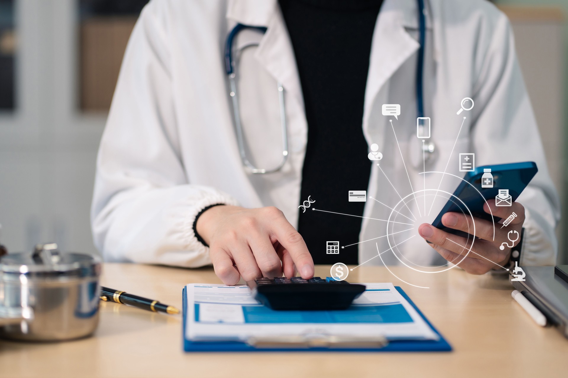 Healthcare costs and fees concept.Hand of smart doctor used a calculator for medical costs in modern hospital with VR icon diagram.